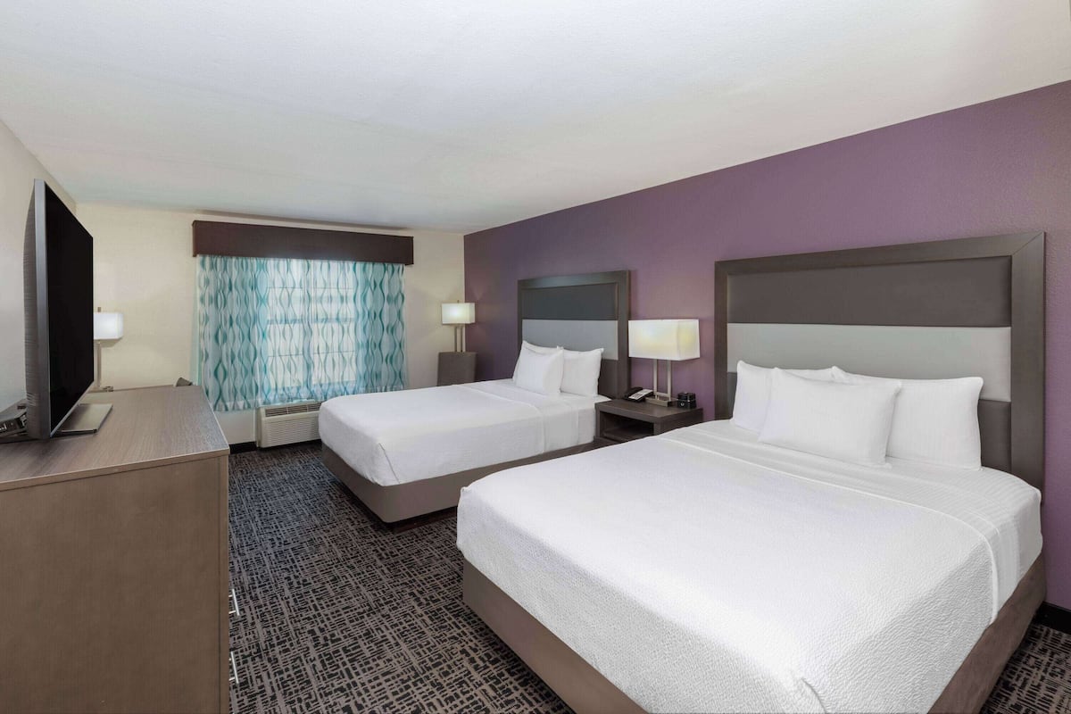 Premium bedding, desk, laptop workspace, iron/ironing board