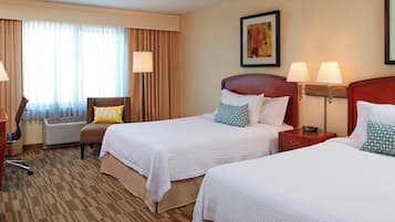 Colchones con pillow-top y caja de seguridad en la habitación