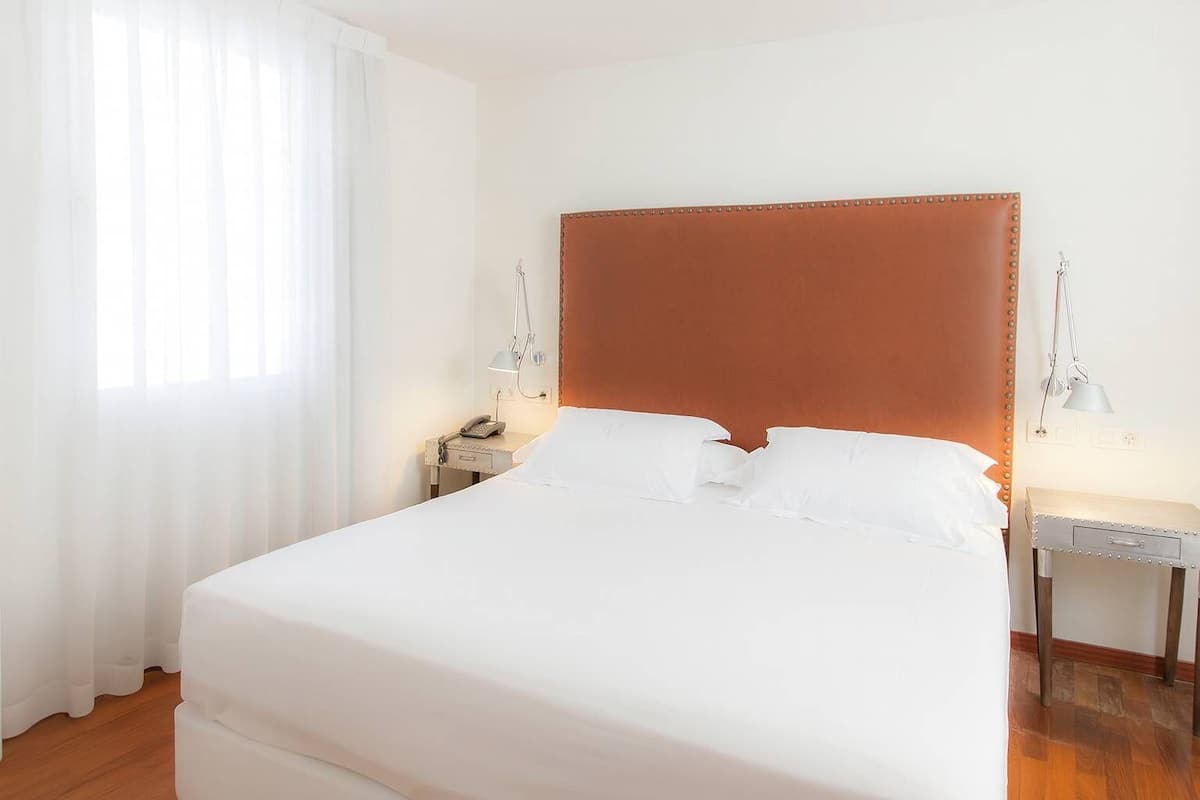 Premium bedding, down comforters, memory foam beds, minibar