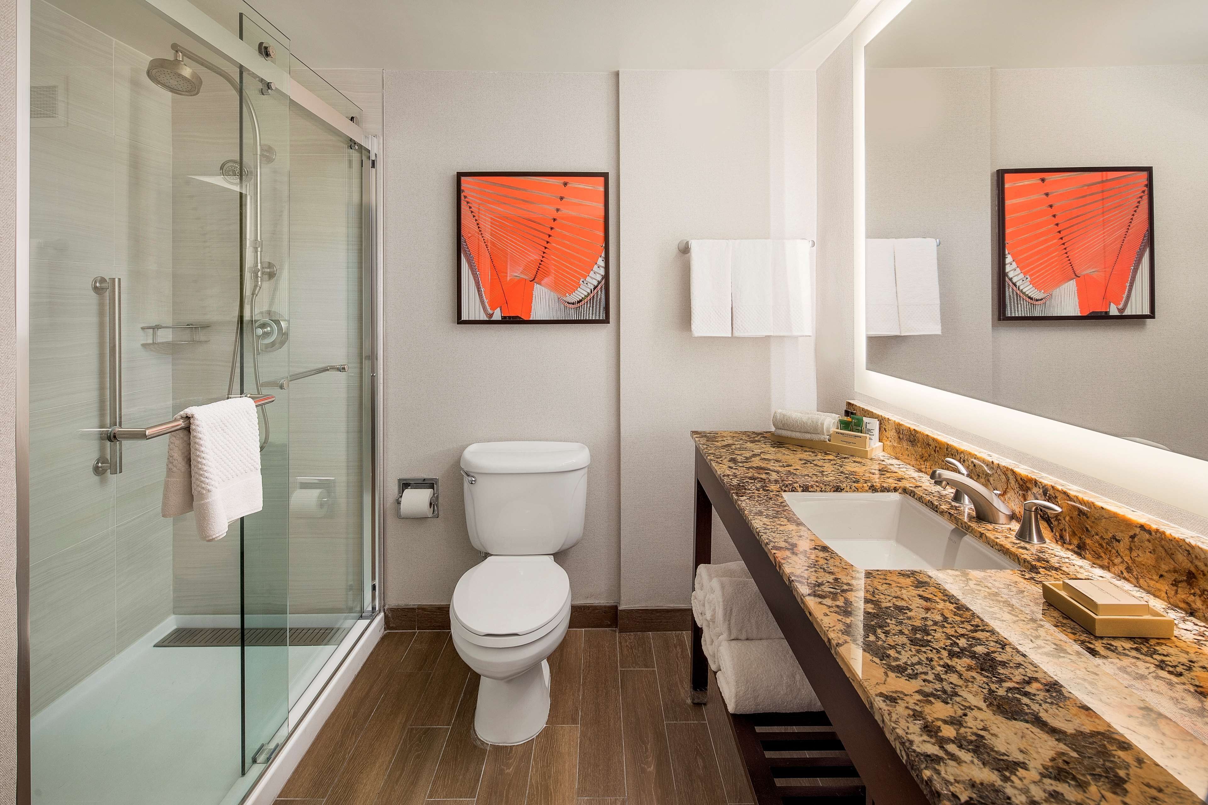 combined shower/bathtub, designer toiletries, hair dryer, bathrobes