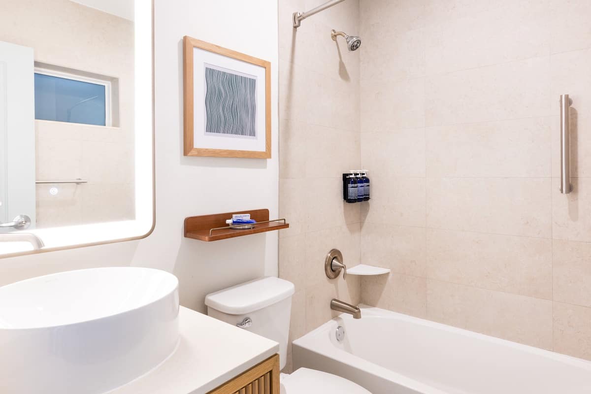 eco-friendly toiletries, hair dryer, bathrobes, slippers