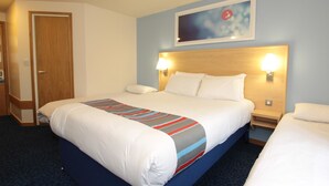 A hotel room with a large bed, two bedside tables, a headboard, and a wall-mounted artwork. - Travelodge Aberdeen Central (Aberdeen)