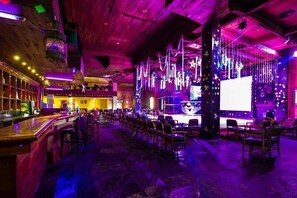6 bars/lounges, poolside bar, beach bar