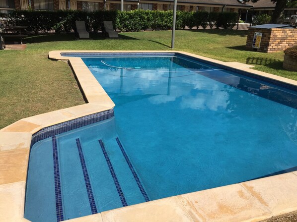 Outdoor pool, open 8:00 AM to 8:00 PM, pool loungers