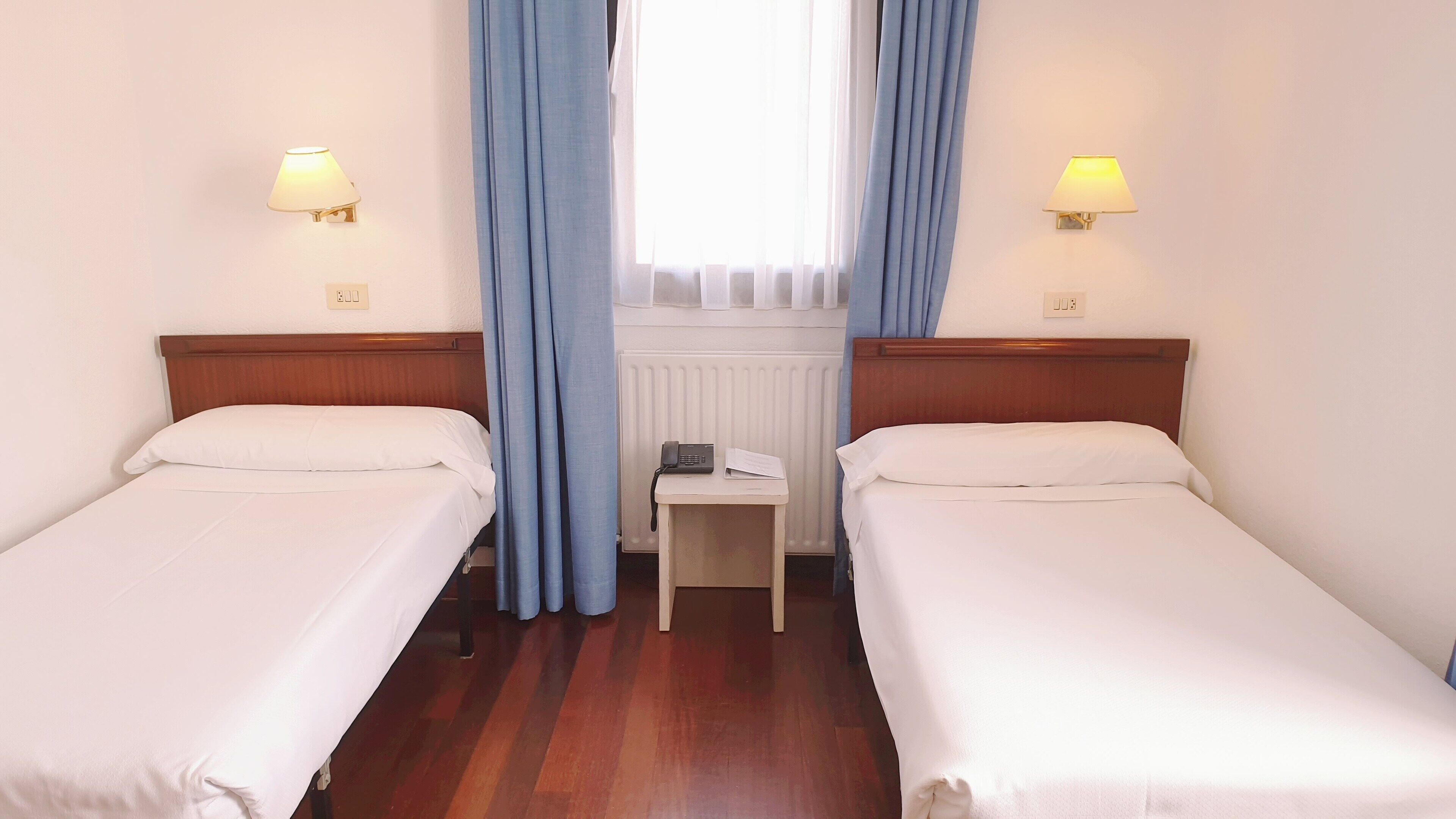 Desk, laptop workspace, blackout curtains, free WiFi