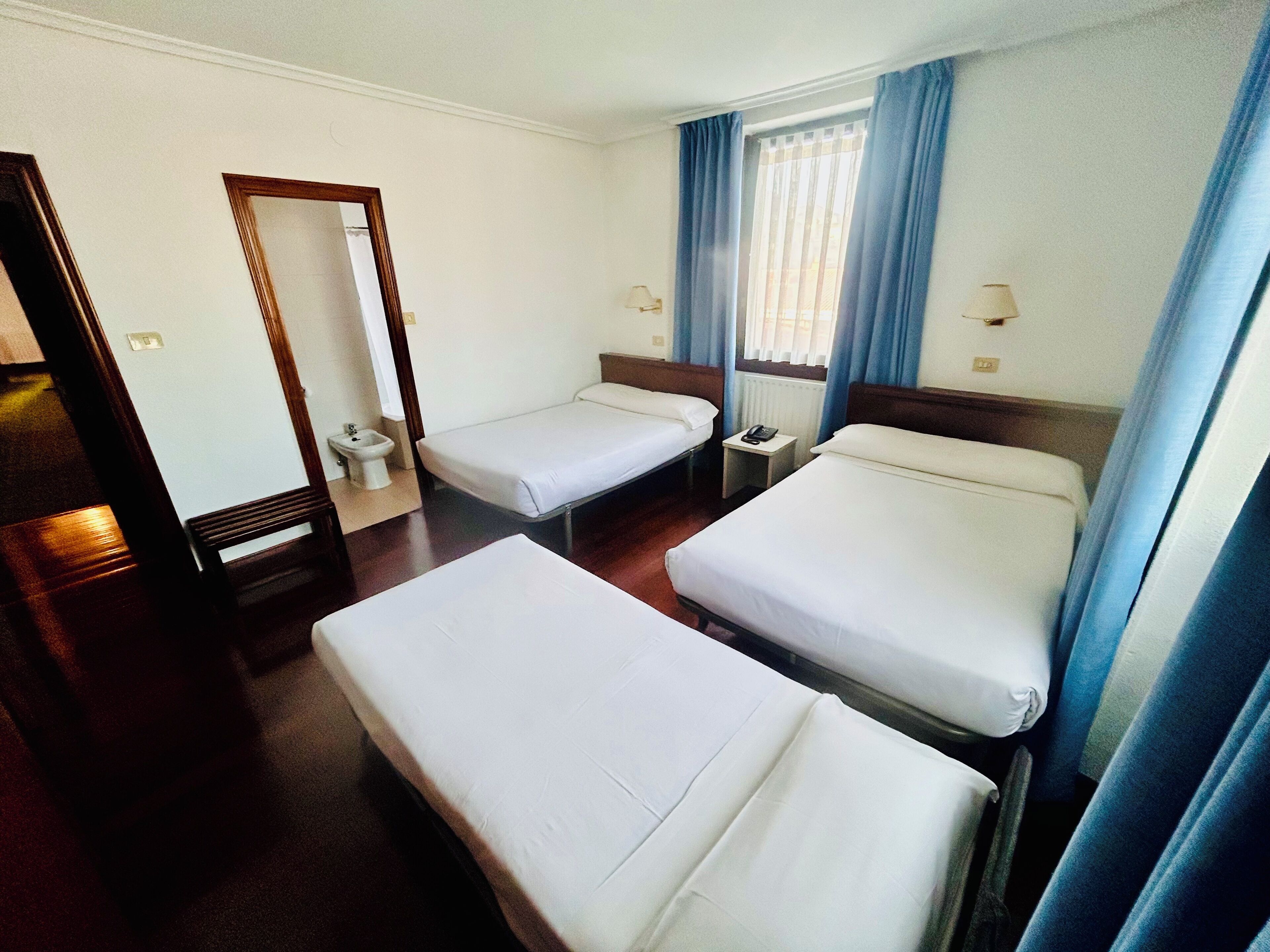 Desk, laptop workspace, blackout curtains, free WiFi