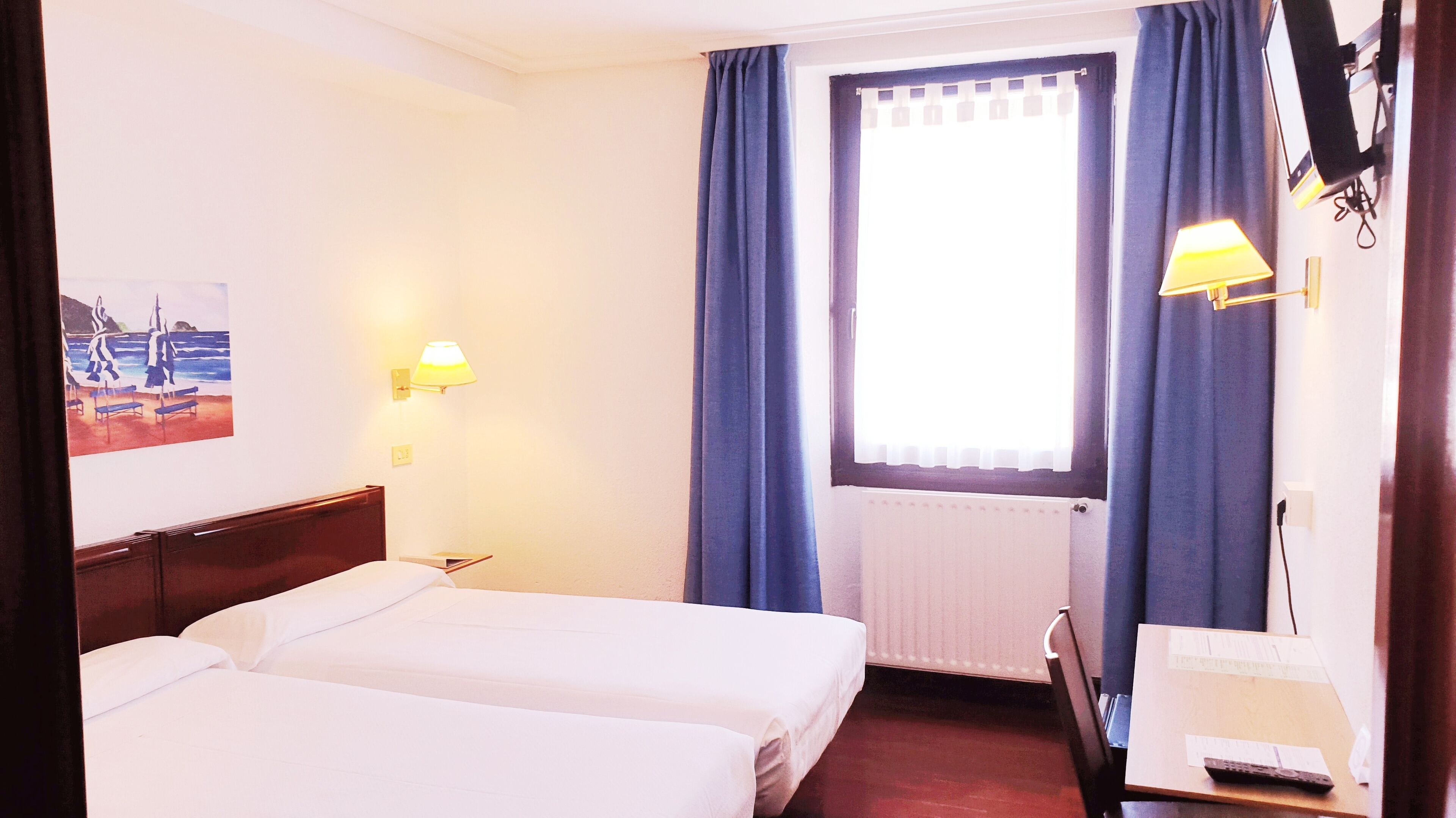 Desk, laptop workspace, blackout curtains, free WiFi