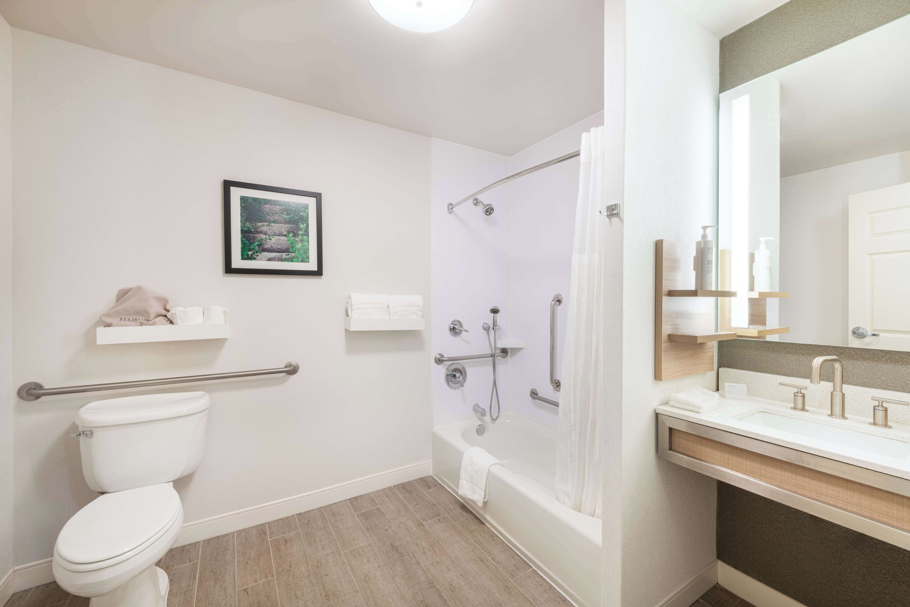 bathtub, free toiletries, hair dryer, towels