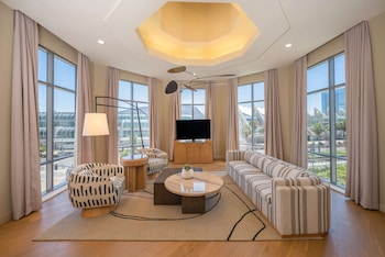 Presidential Loft Suite - 1 King | Living area | 60-inch flat-screen TV with cable channels, TV, pay movies at Hilton San Diego Gaslamp Quarter