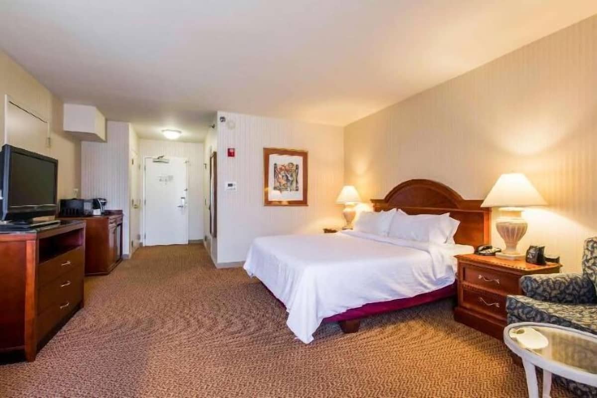 Premium bedding, desk, laptop workspace, iron/ironing board