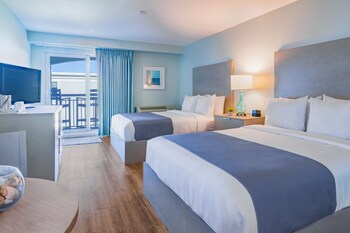 Enjoy a comfortable stay with two single beds, a flat-screen TV, and a desk for work or relaxation. at The Palms Oceanfront Hotel