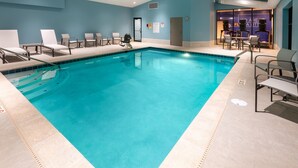 A swimming pool with lounge chairs and a changing room. - Holiday Inn Express & Suites Wadsworth by IHG (Wadsworth)