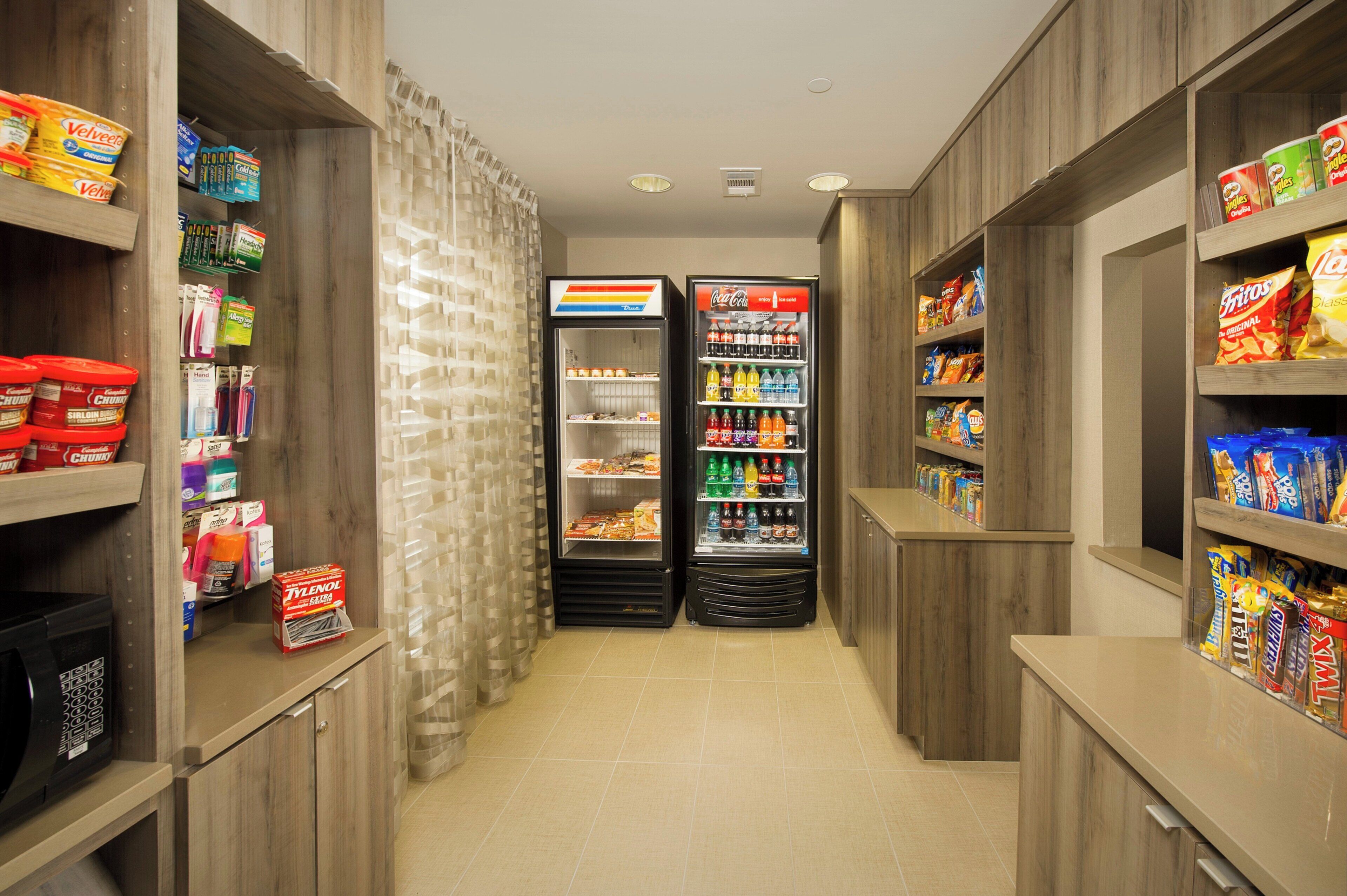 A snack and beverage vending area with various products.