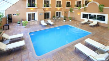 Indoor pool, open 8:00 AM to 8:00 PM, pool loungers