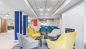 A modern office space with a reception area, a dining area, and several seating arrangements. - Holiday Inn Express Hotel & Suites Carneys Point by IHG (Penns Grove)