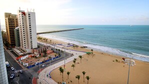 A coastal cityscape with a beach, high-rise buildings, and a clear view of the ocean. - Holiday Inn Fortaleza by IHG (Fortaleza)
