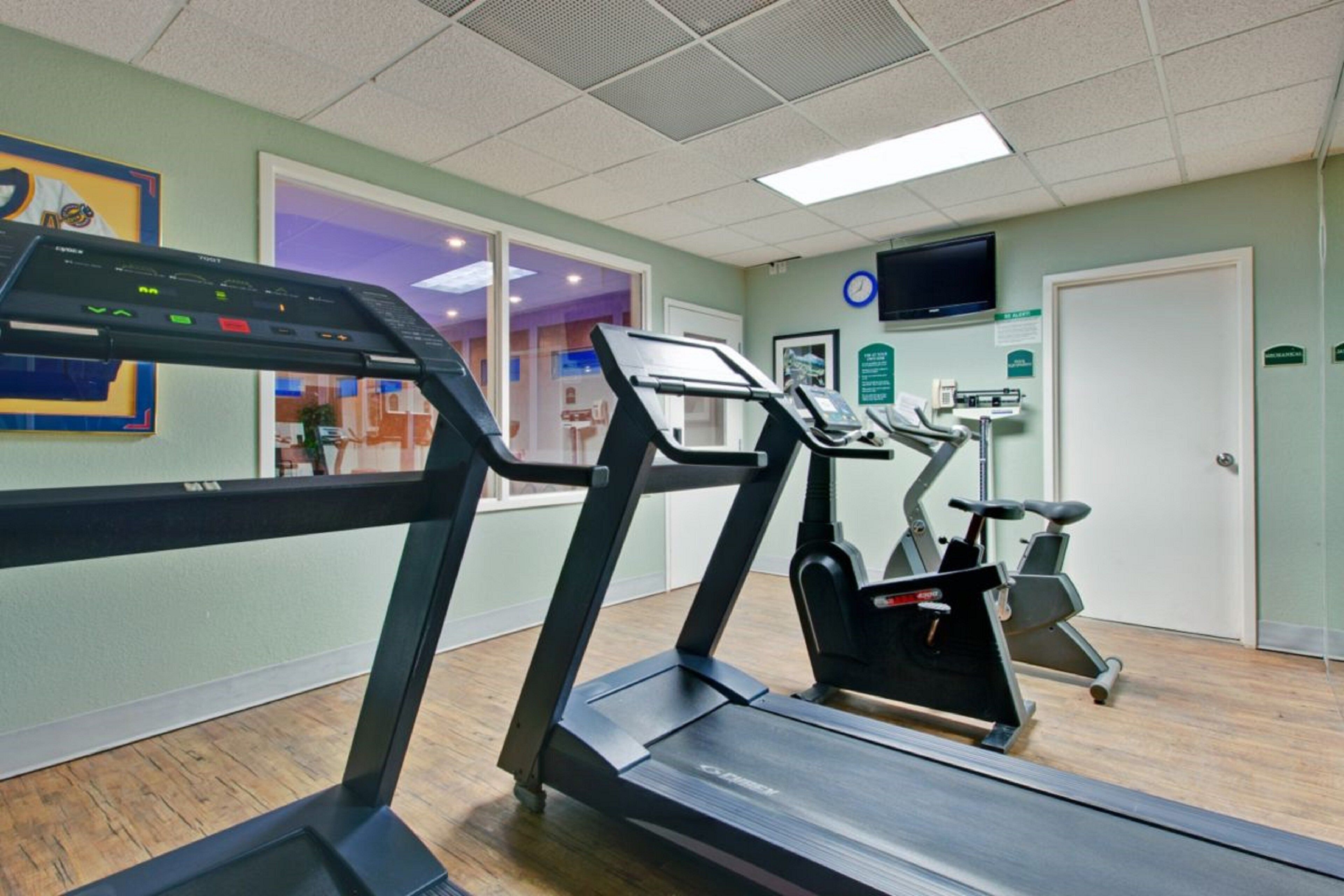 A fitness center with treadmills and exercise equipment.