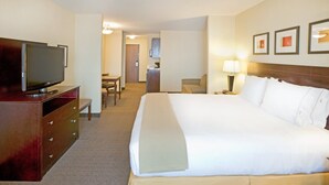 A hotel room with a large bed, a TV on a wooden dresser, a desk, and a chair. - Holiday Inn Express & Suites Eagle Pass by IHG (Eagle Pass)