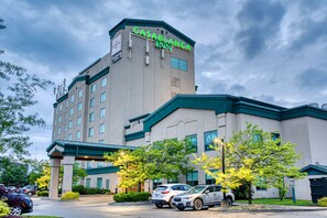 A hotel with a prominent sign reading "CASABLANCA INN" and a parking lot with several cars. - The Casablanca Hotel (Grimsby)