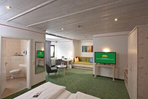 Double Room (Flair Plus) | Living area | Flat-screen TV