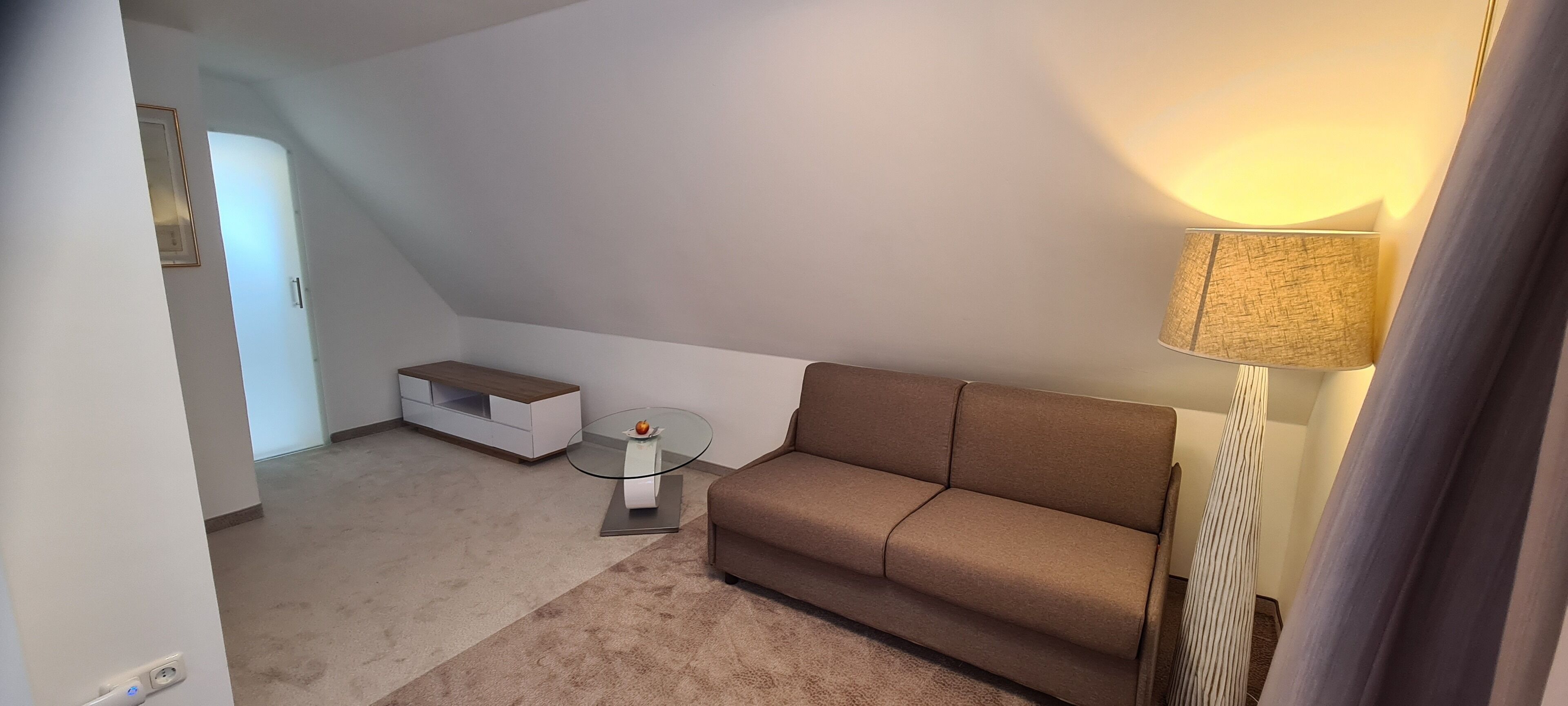 standard double room | living area | 26-cm flat-screen tv with cable channels, tv