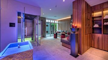 Relax in our spacious lobby with a seating area, reception desk, and beautifully displayed towels.