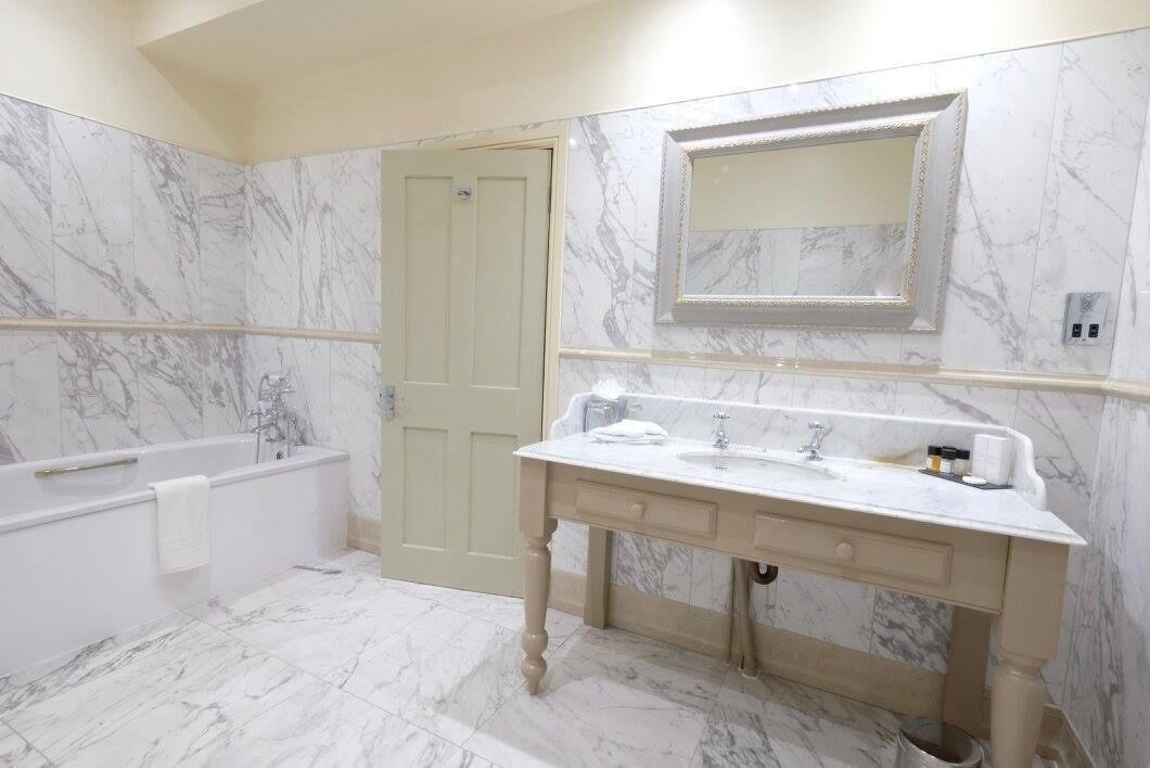 junior suite | bathroom | combined shower/bathtub, hair dryer, bathrobes, bidet