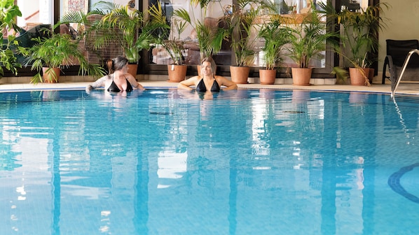Indoor pool, open 7:30 AM to 8:30 PM, pool loungers