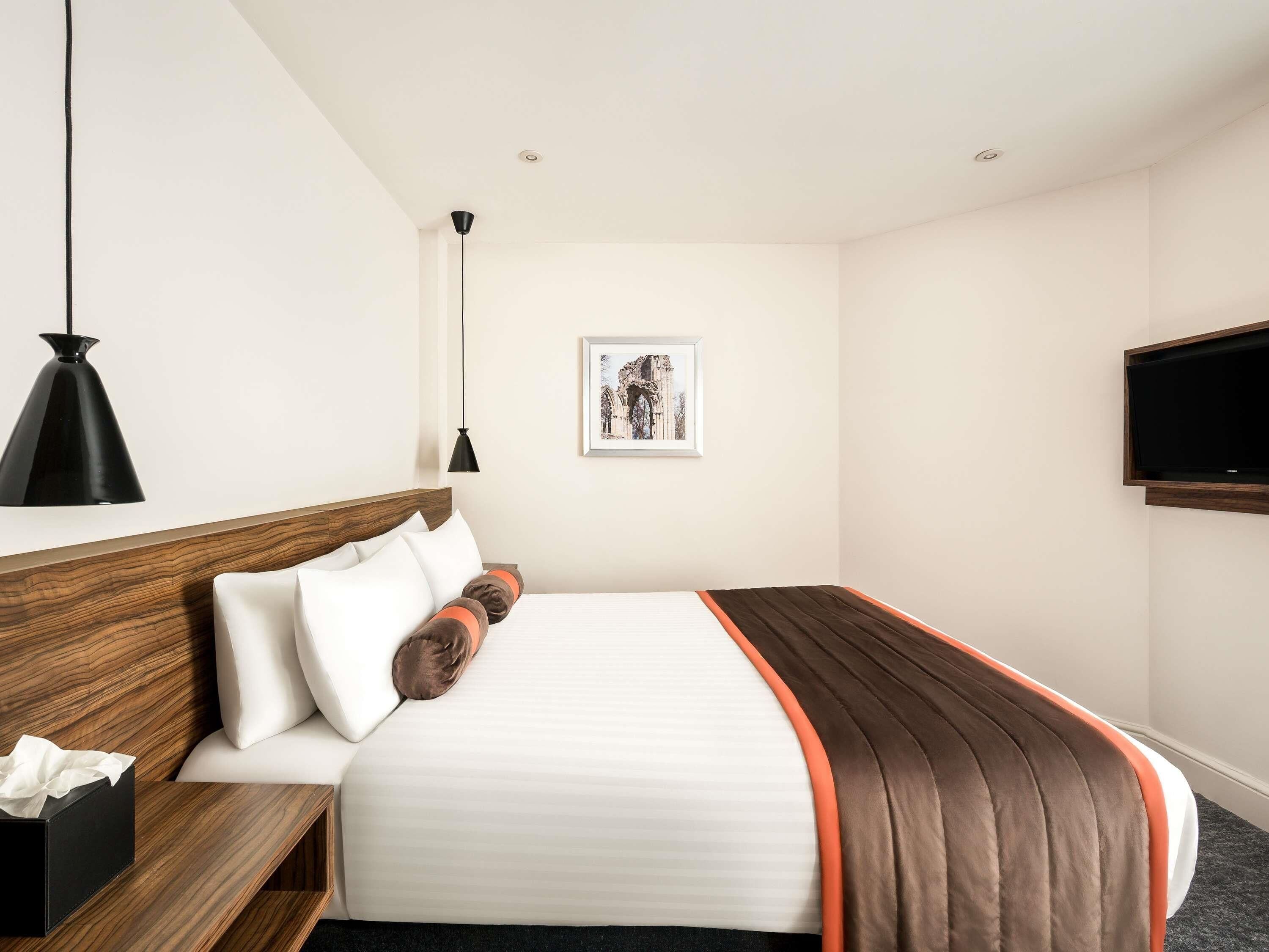 Hypo-allergenic bedding, pillow-top beds, desk, laptop workspace