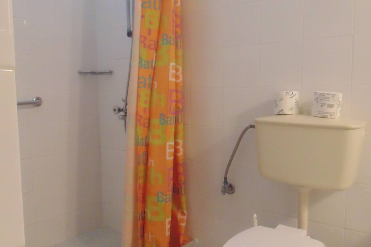 family apartment | bathroom | shower, free toiletries, hair dryer, slippers