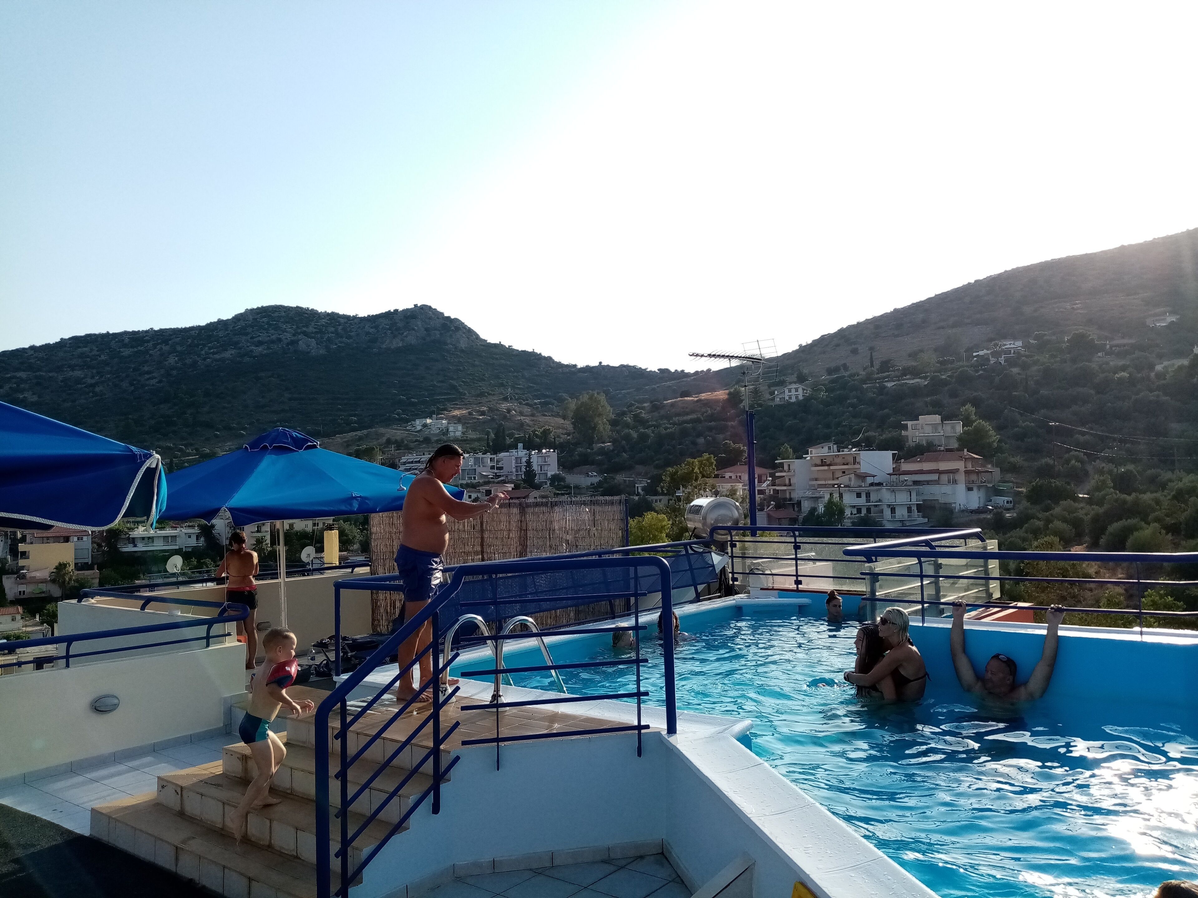 outdoor pool, pool umbrellas, pool loungers