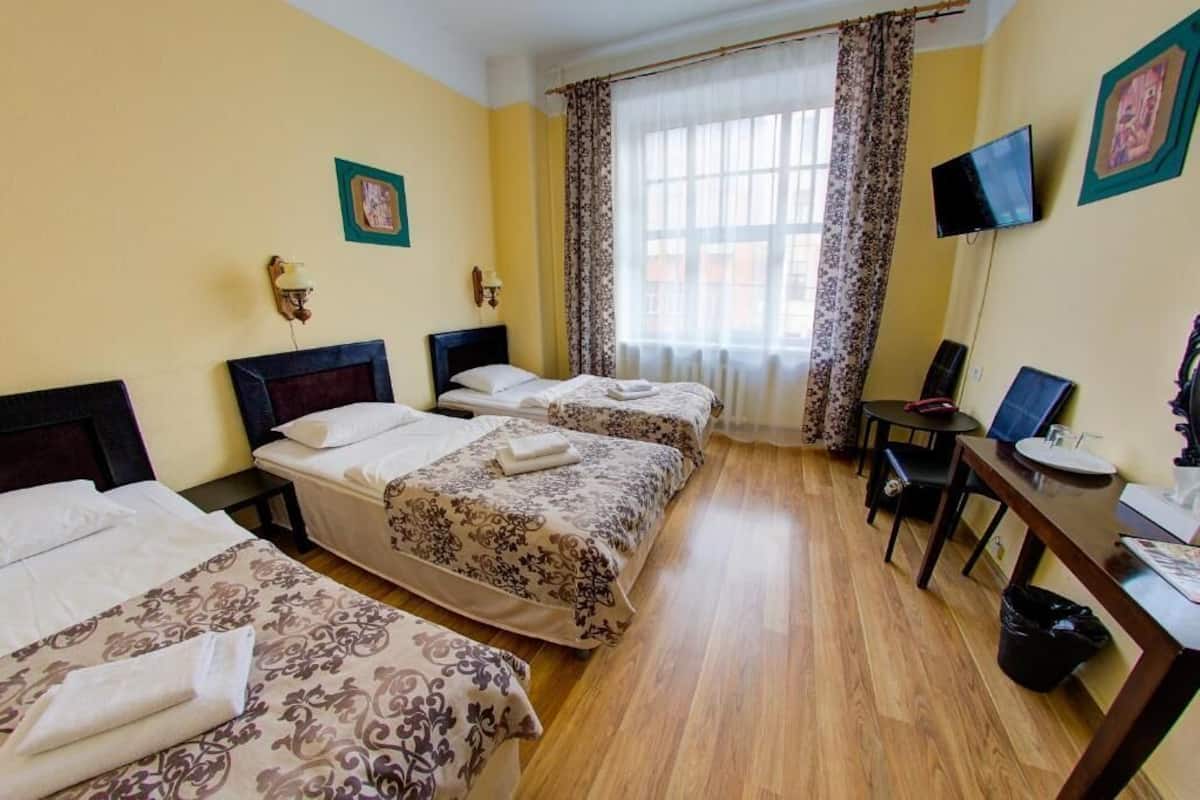 Triple Room, 3 Single Beds | Individually decorated, individually furnished, desk, laptop workspace