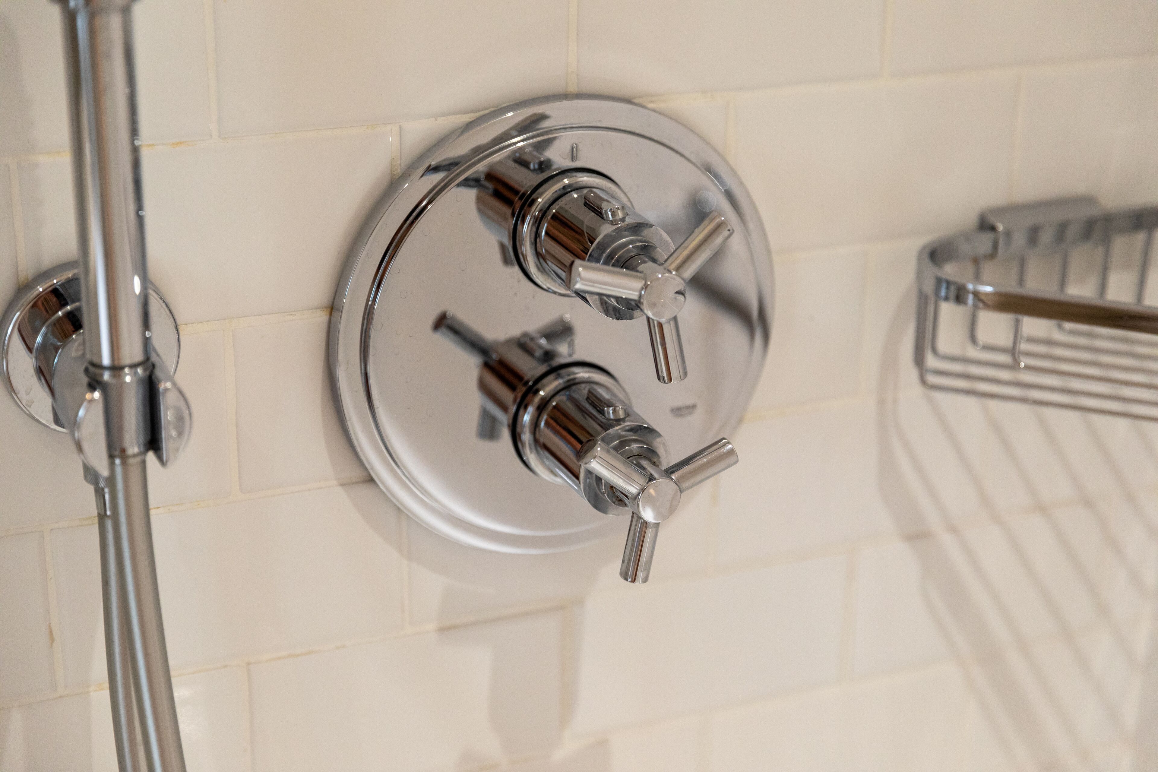 luxury suite | bathroom | combined shower/bathtub, designer toiletries, hair dryer, towels