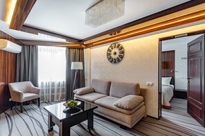 Deluxe Suite, 2 Queen Beds, City View | Living area | TV