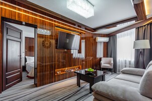 Deluxe Suite, 2 Queen Beds, City View | Living area | TV