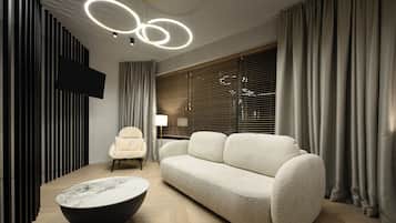 Penthouse Suite | Zona de estar | Televisión LED de 35 pulgadas con canales por cable, una televisión