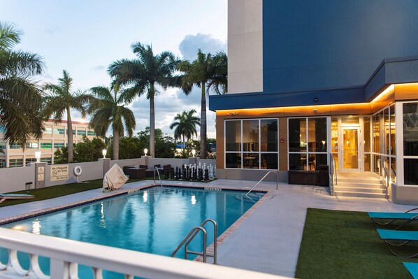 Outdoor pool, open 8:00 AM to 10:00 PM, pool loungers