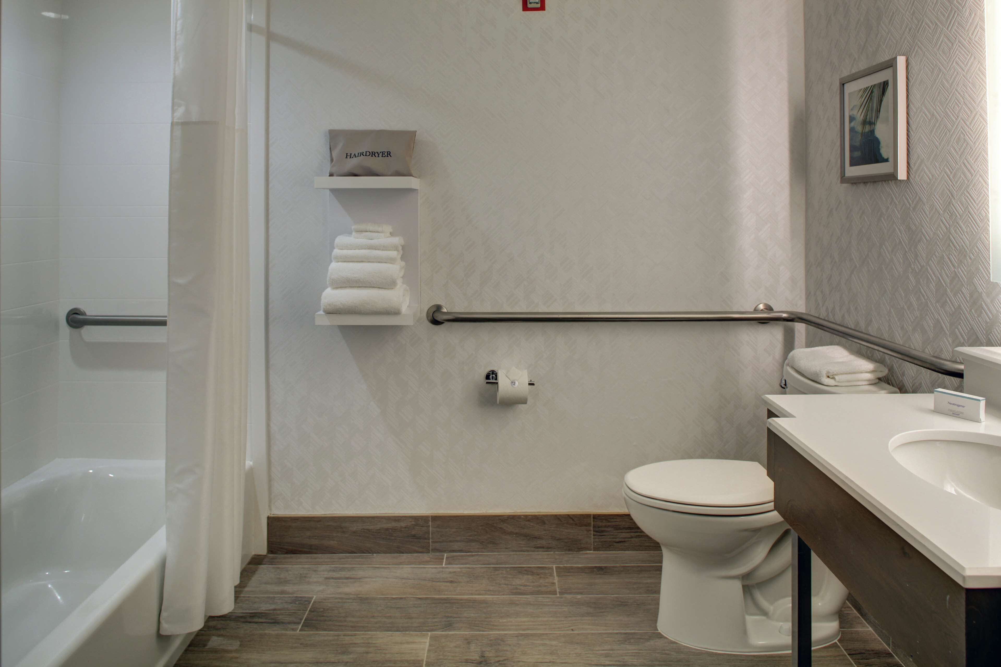 room, 1 king bed, accessible, bathtub (mobility & hearing) | bathroom | combined shower/bathtub, free toiletries, hair dryer, towels