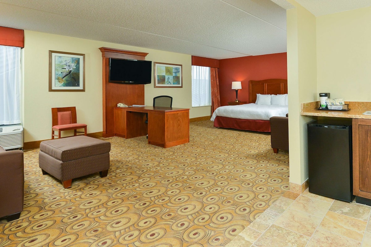 Premium bedding, down comforters, blackout drapes, iron/ironing board