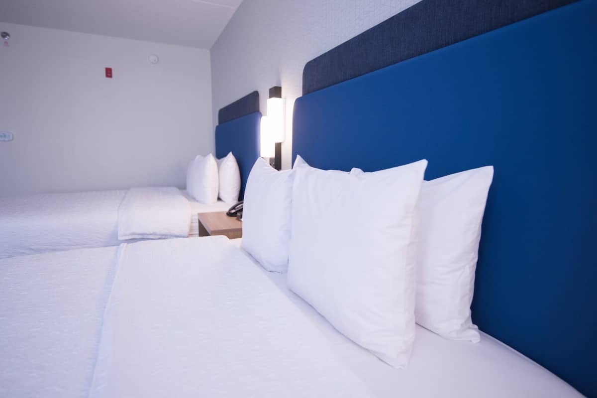 Premium bedding, down comforters, blackout drapes, iron/ironing board