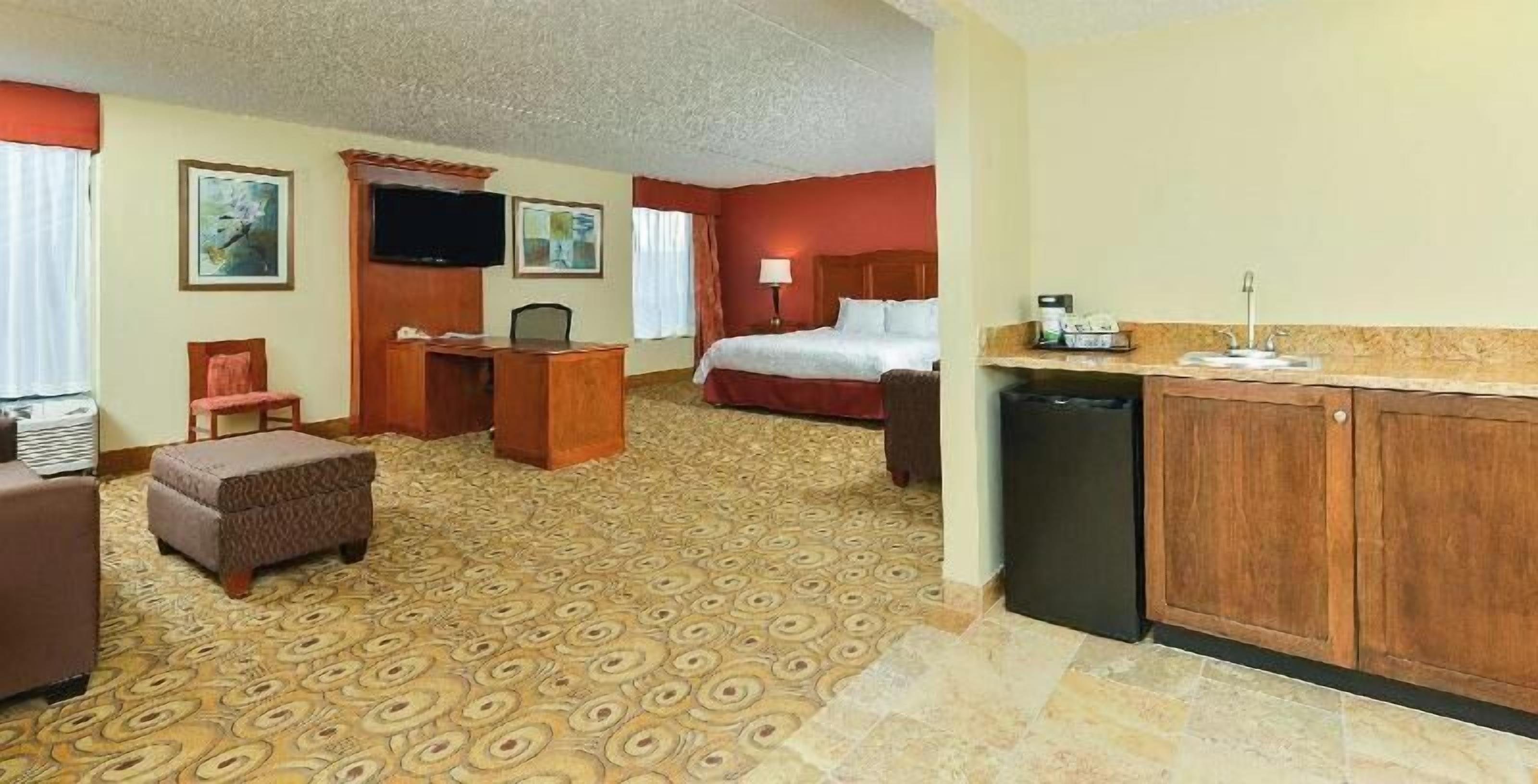 Premium bedding, down comforters, blackout drapes, iron/ironing board