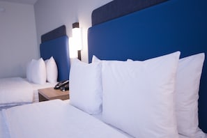 Literie de qualité, couette en duvet, rideaux d’obscurcissement