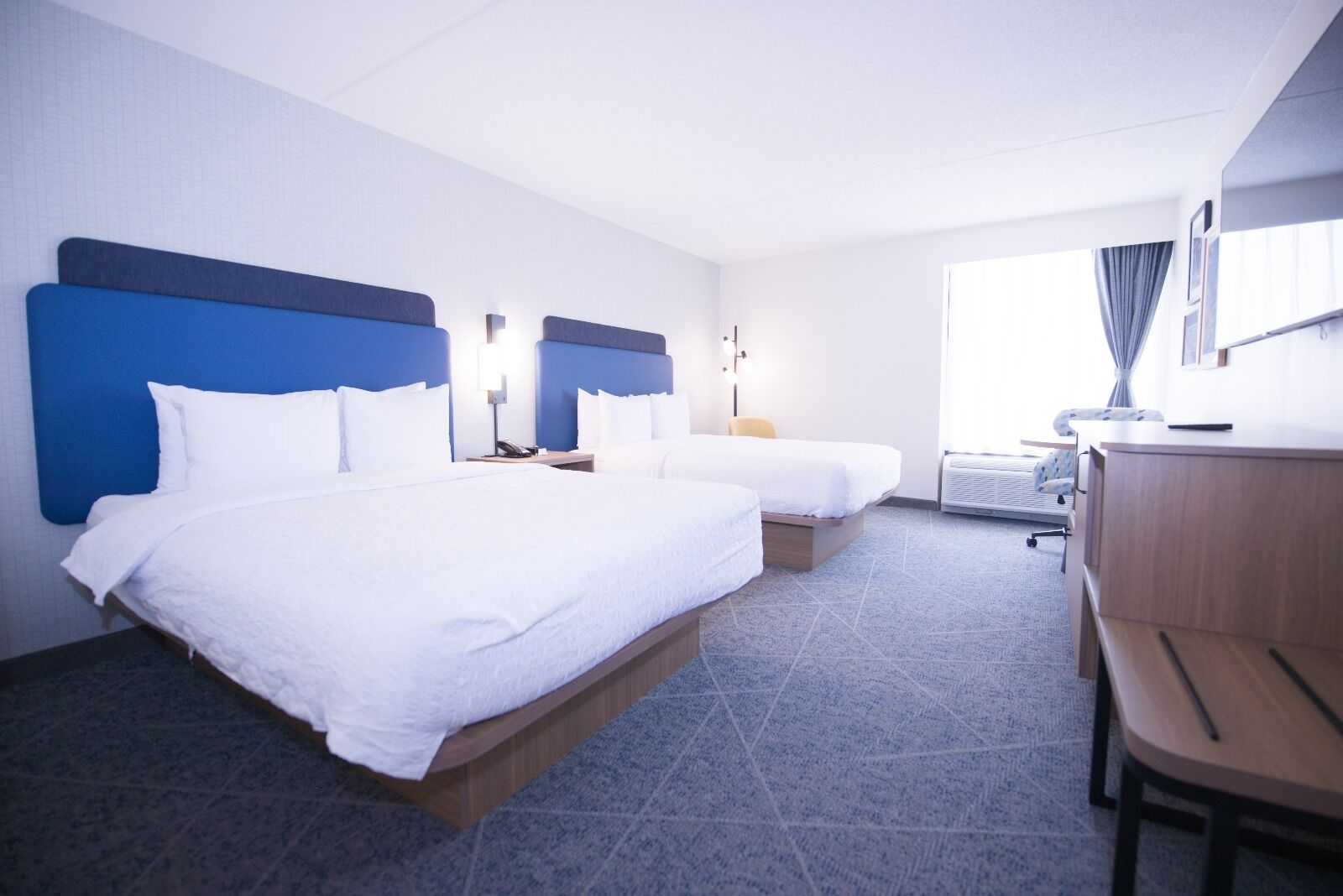 premium bedding, down duvets, blackout curtains, iron/ironing board