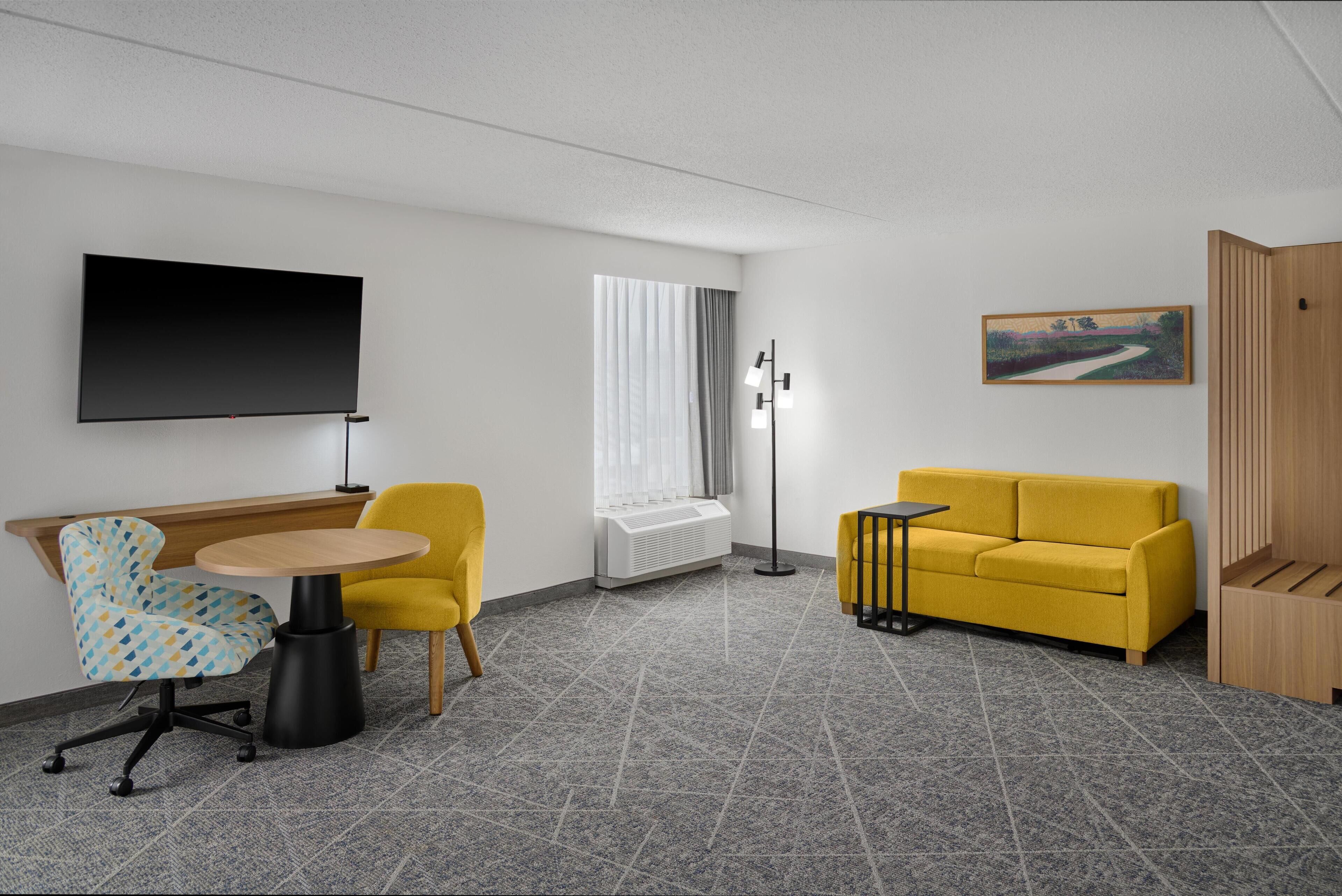 Premium bedding, down comforters, blackout drapes, iron/ironing board