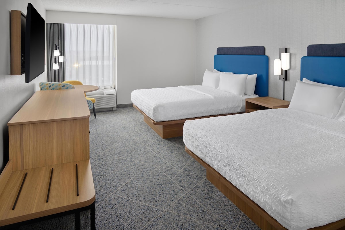 Premium bedding, down comforters, blackout drapes, iron/ironing board