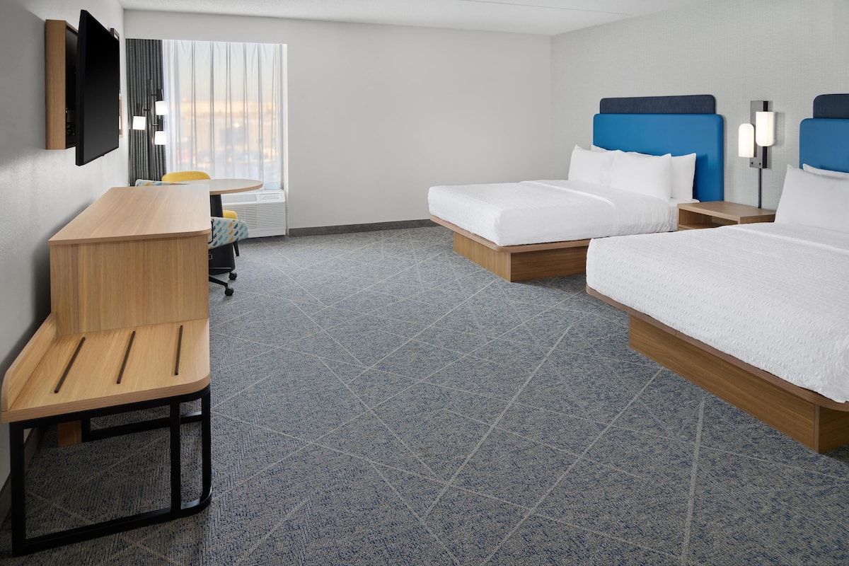 Premium bedding, down comforters, blackout drapes, iron/ironing board