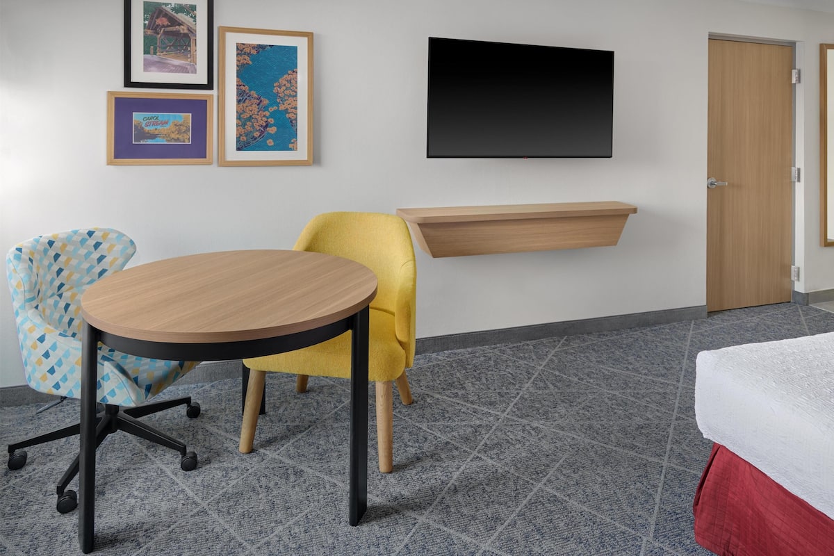 Premium bedding, down comforters, blackout drapes, iron/ironing board