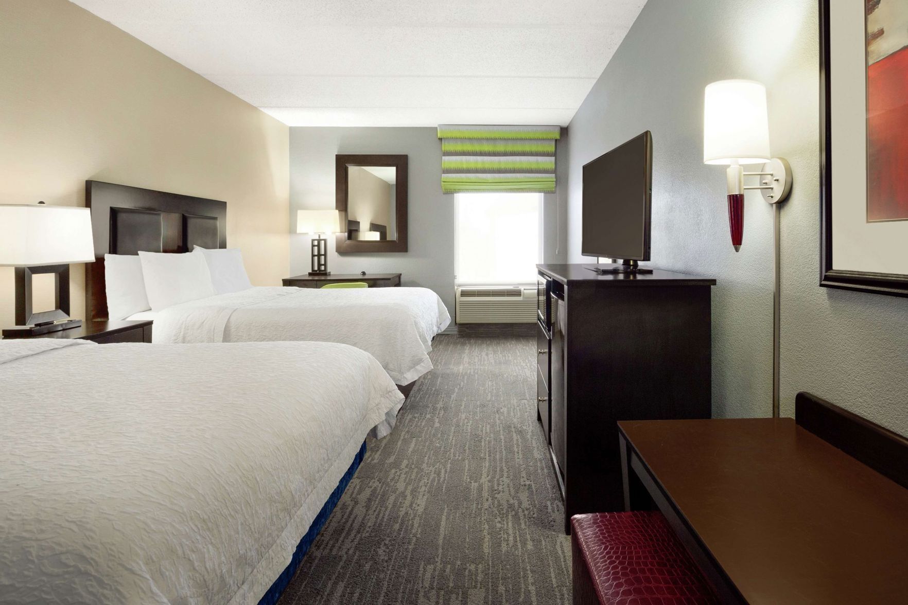 Premium bedding, desk, laptop workspace, blackout drapes