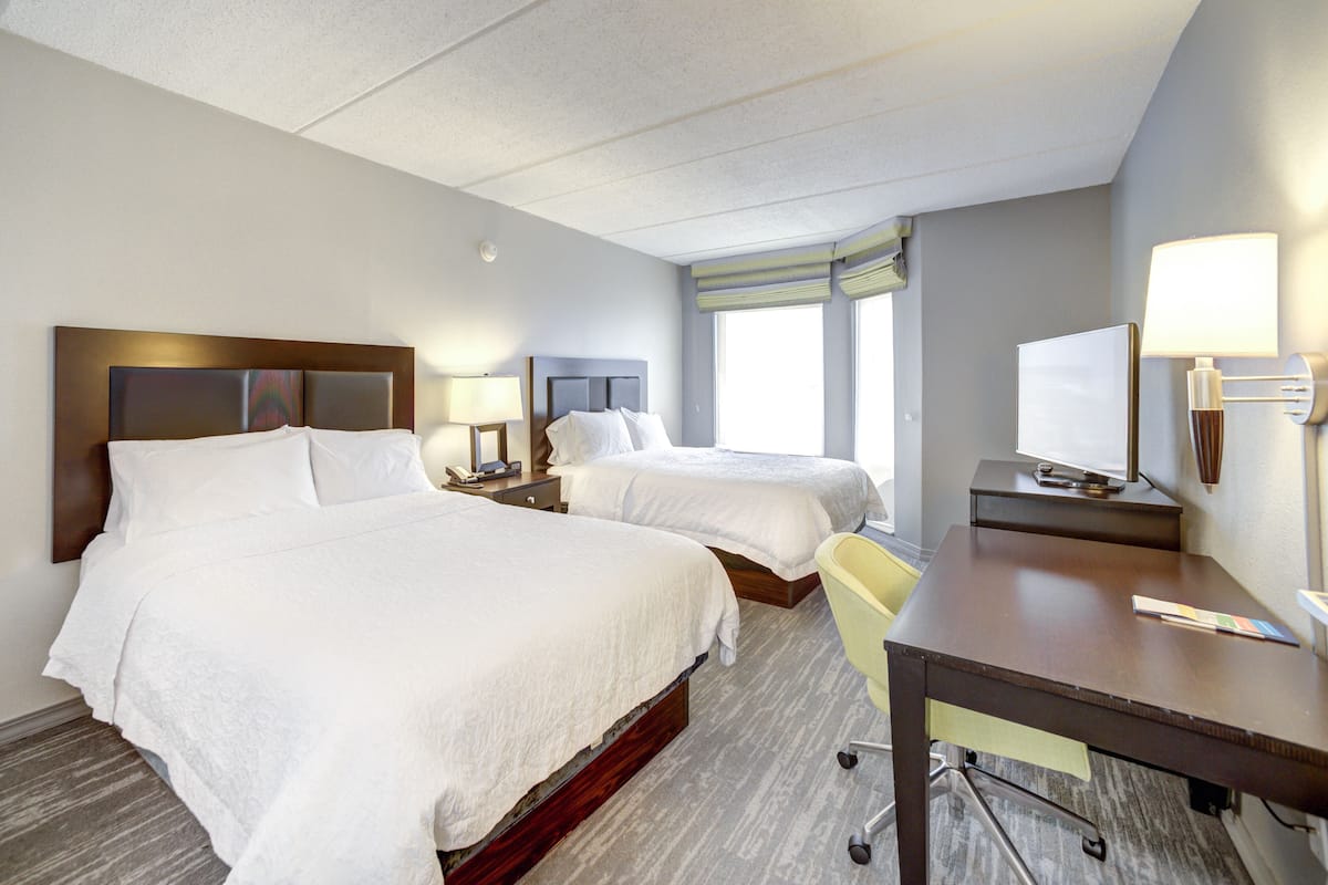 premium bedding, desk, laptop workspace, blackout curtains