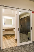 Suite, 1 King Bed, Non Smoking (Hospitality) | Bathroom | Free toiletries, hair dryer, towels